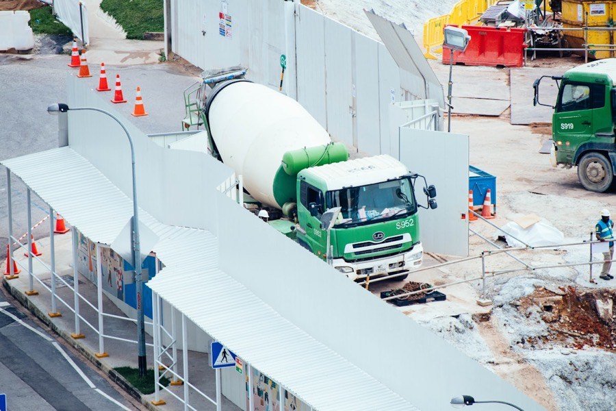 Concrete mixer truck delivering on-site concrete